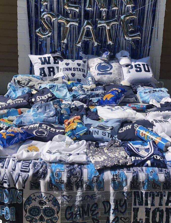 College bed party with blue and white dorm decor