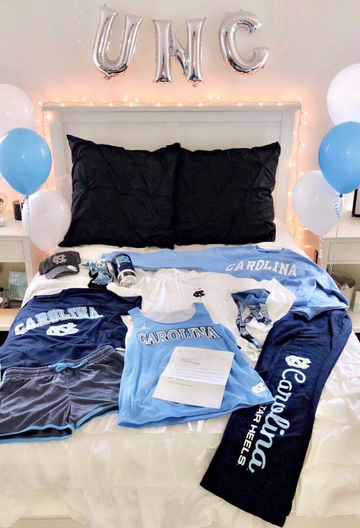 College bed party with blue and white dorm decor