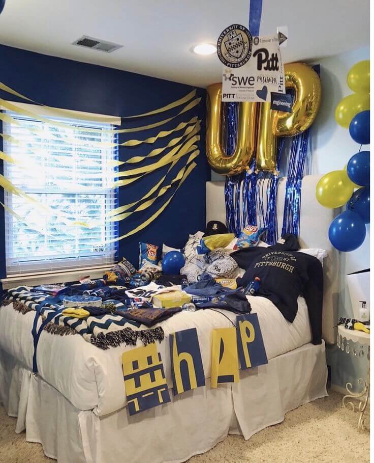 College bed party with blue and white dorm decor